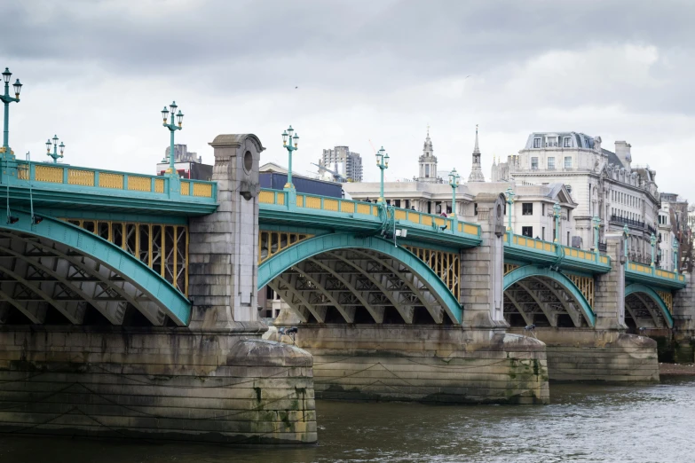 the bridge and towers are green, yellow, and white