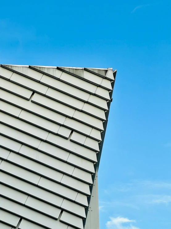 a kite is in the air above the roof