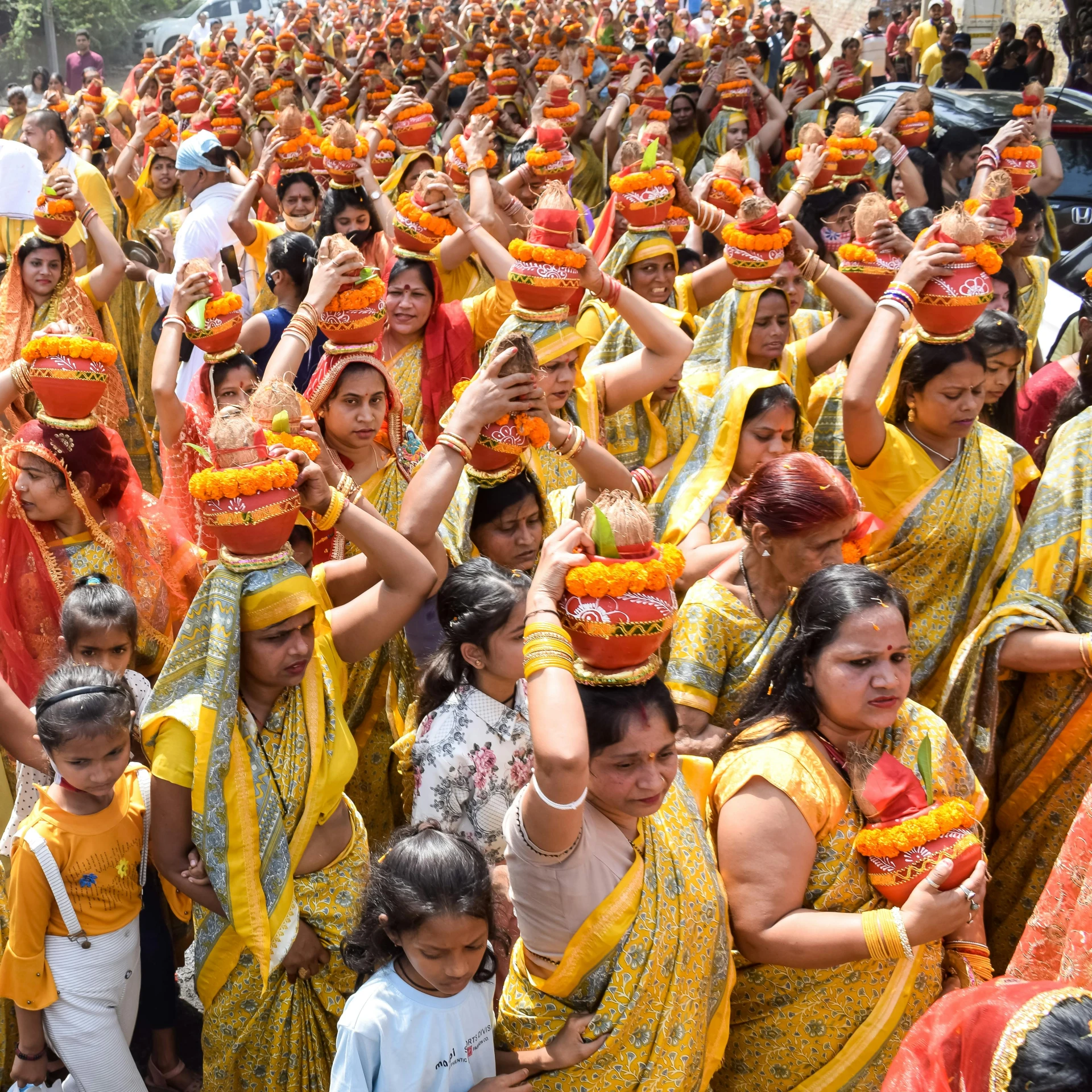 many people wearing brightly colored outfits are lined up