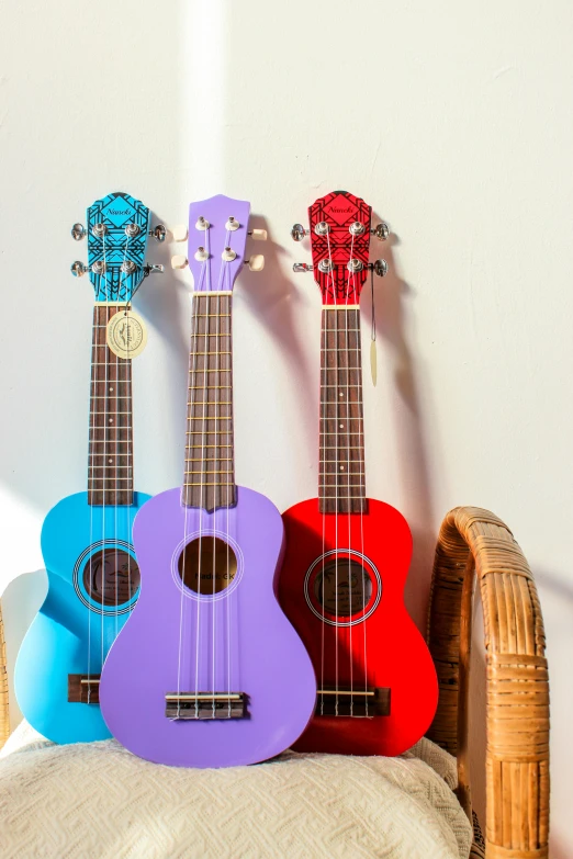 the guitars in a room are colorfully decorated