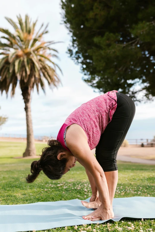 a woman stretching her arms up to balance