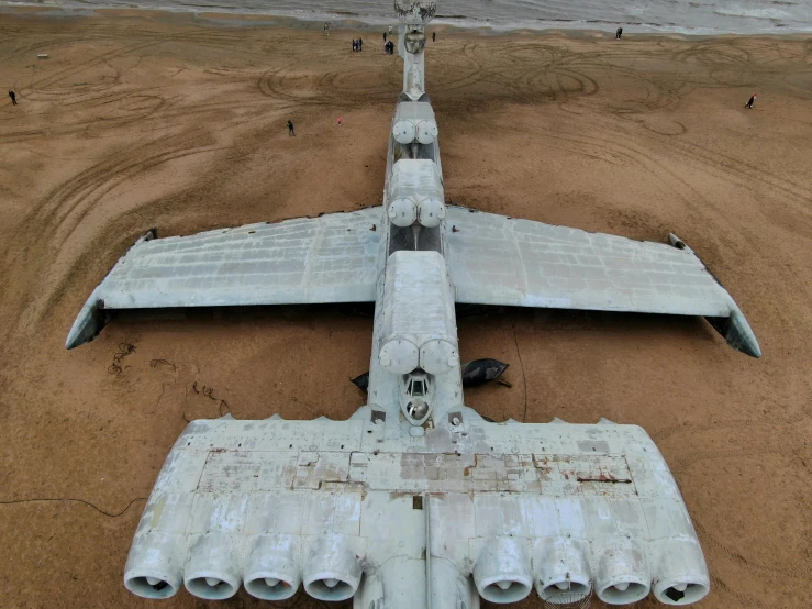 an airplane that is on the ground with some pipe