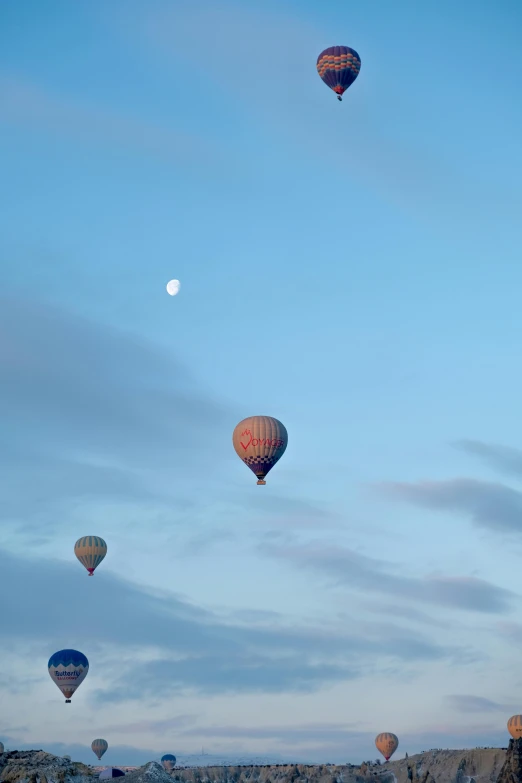 several balloons are flying in the sky at night