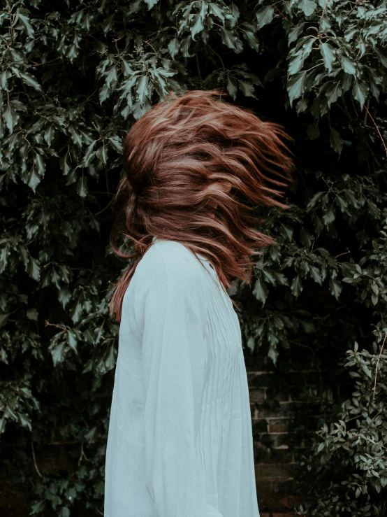 a woman with long hair on a walk