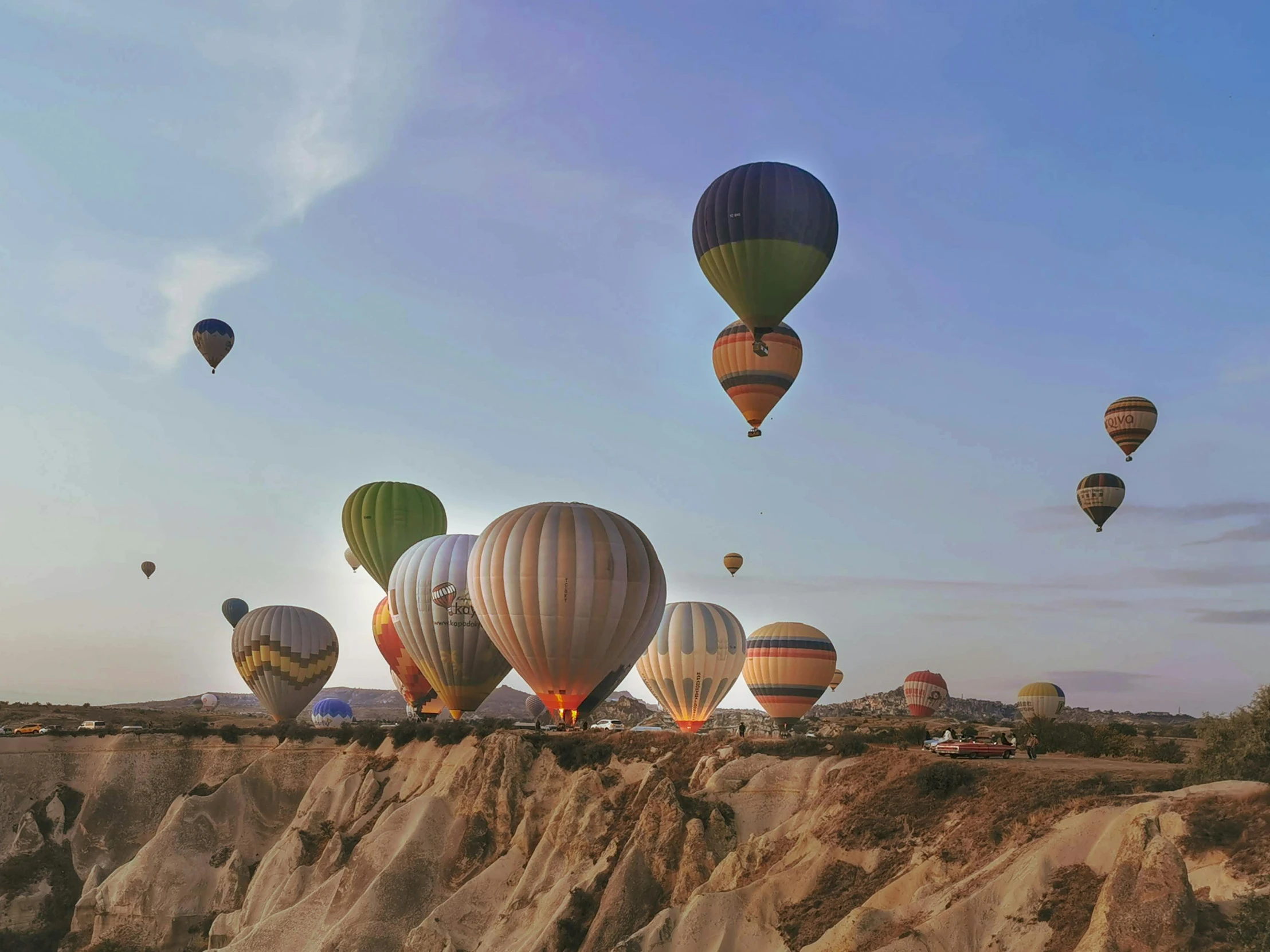 a bunch of balloons floating through the air