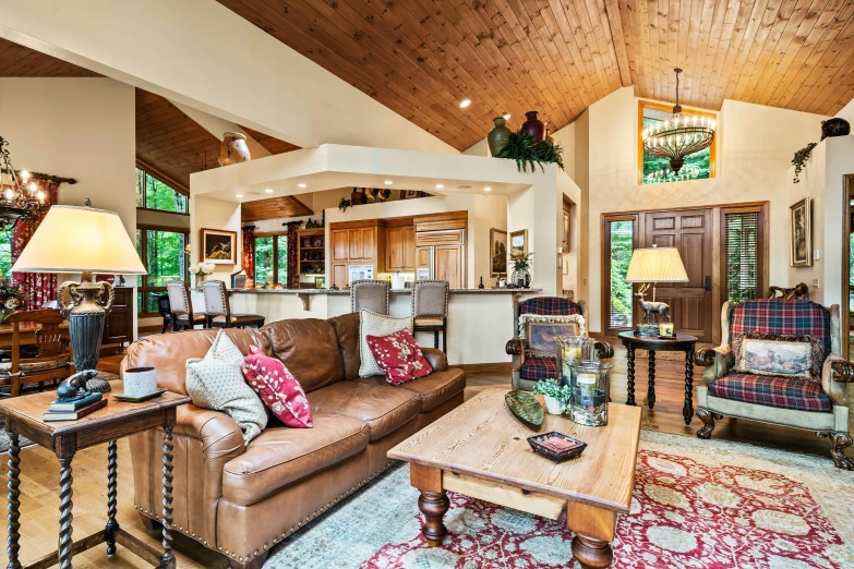 a living room with couches, chairs and tables