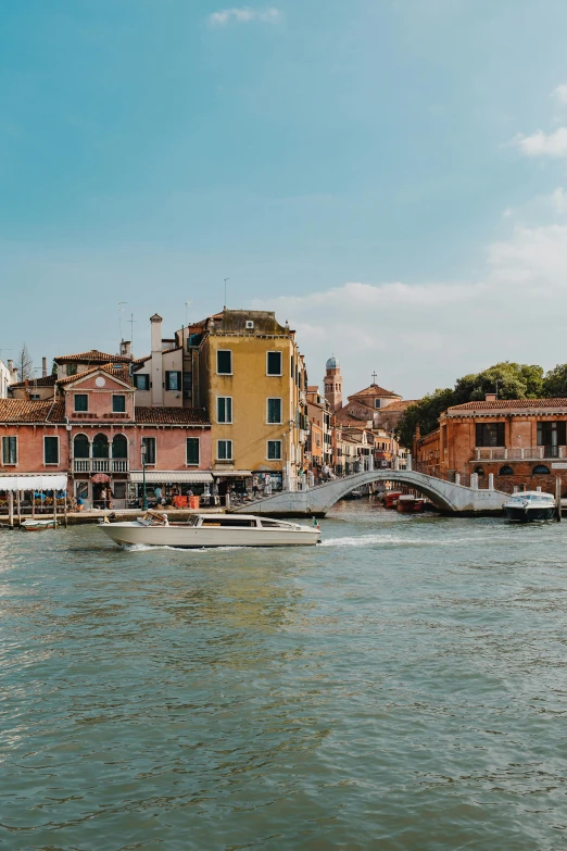 a row of houses on top of an island on water