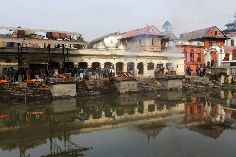 a small canal running through the middle of a town