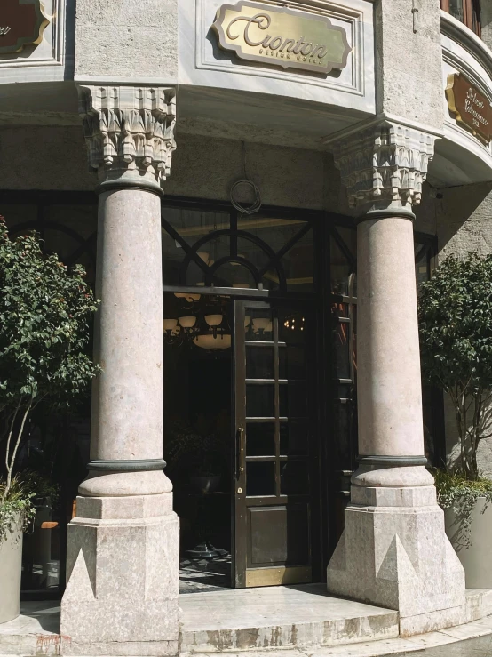 a building with many pillars and a door