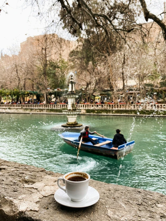 two people on boats going down a river