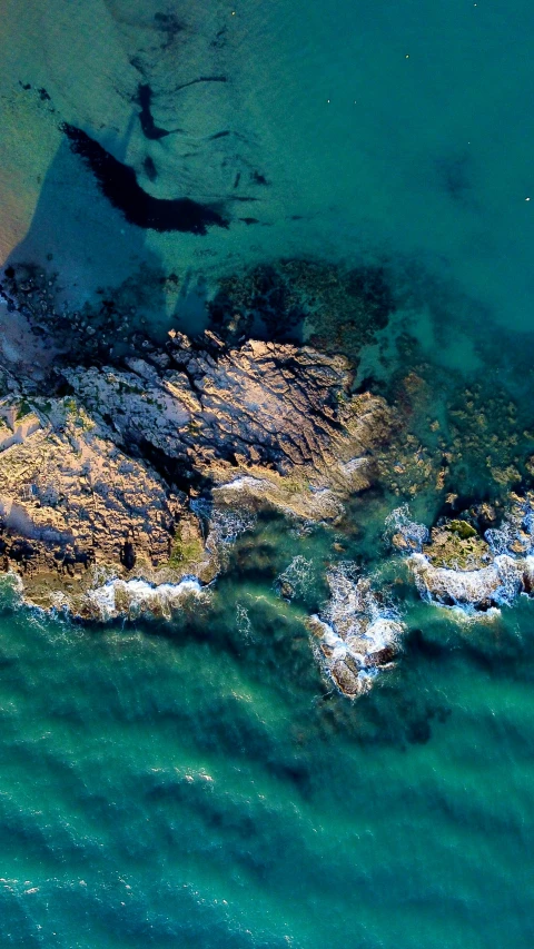 the view from an airplane over some very pretty water