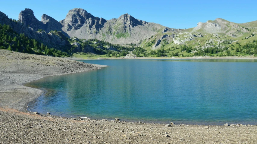 water in a lake near some mountains