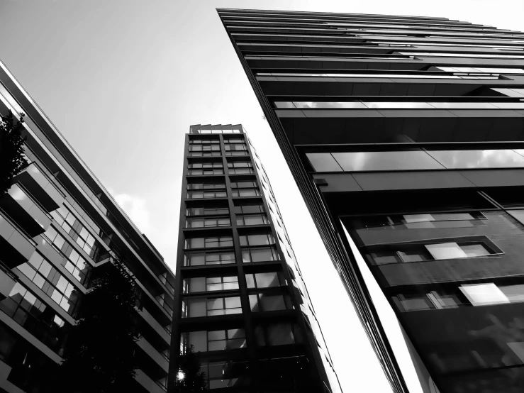 a black and white view of two tall buildings