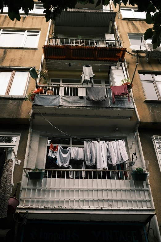 clothes hanging outside a high rise apartment building