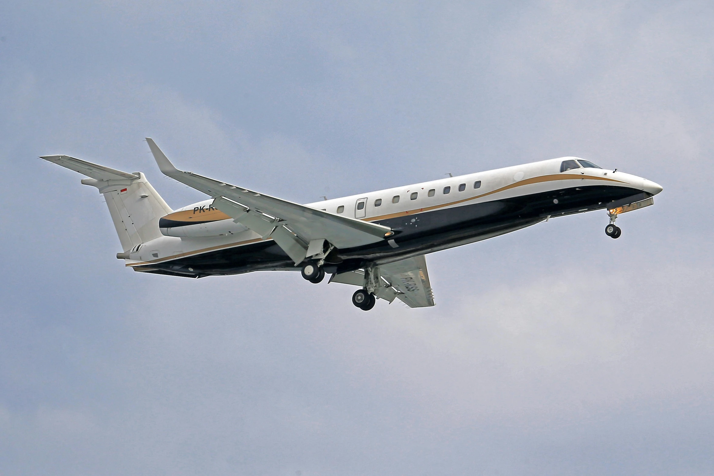 a plane flying in the sky during the day