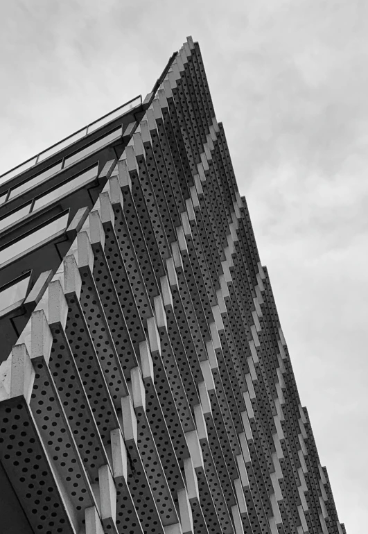 a close up of an office building near a clock