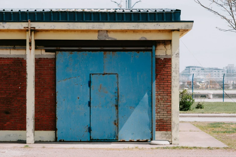 two wooden doors open on an old building