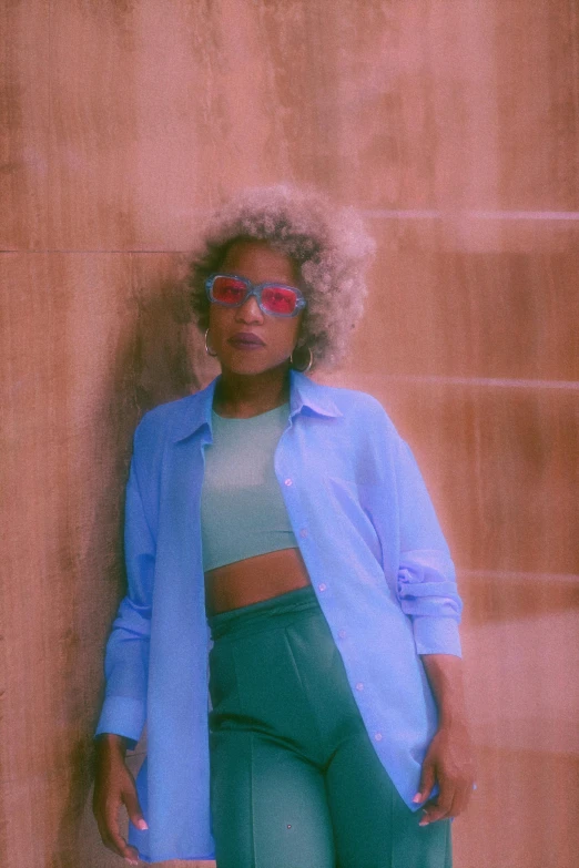 an image of a woman posing in front of a wall