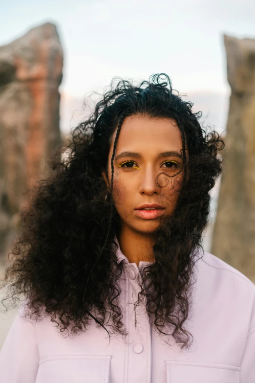 a girl with curly hair has some serious makeup