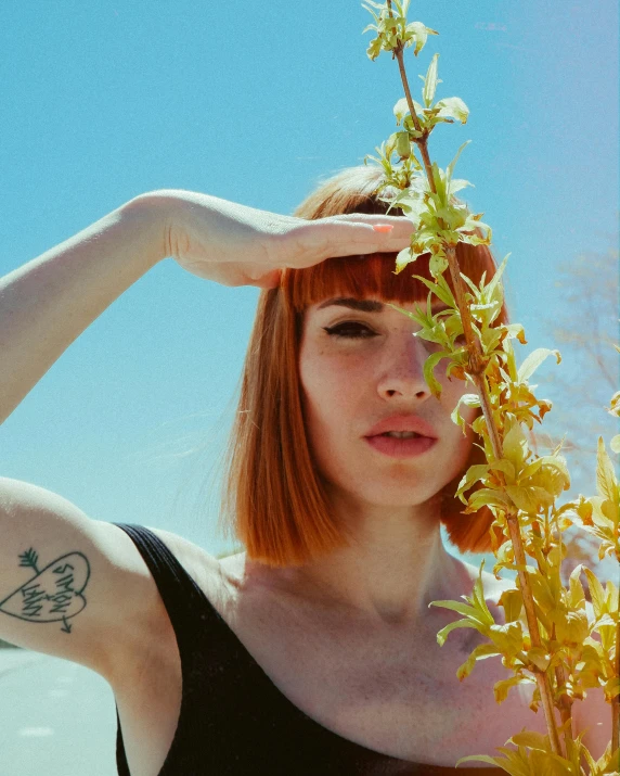 a close up of a woman holding flowers