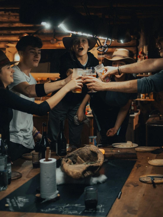 a group of people standing around each other holding hands