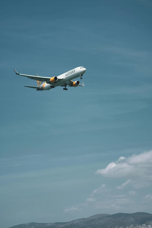 an airplane flies through the air while it's landing