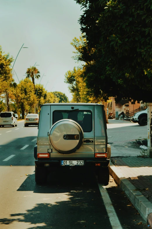 a small jeep parked in the middle of a street