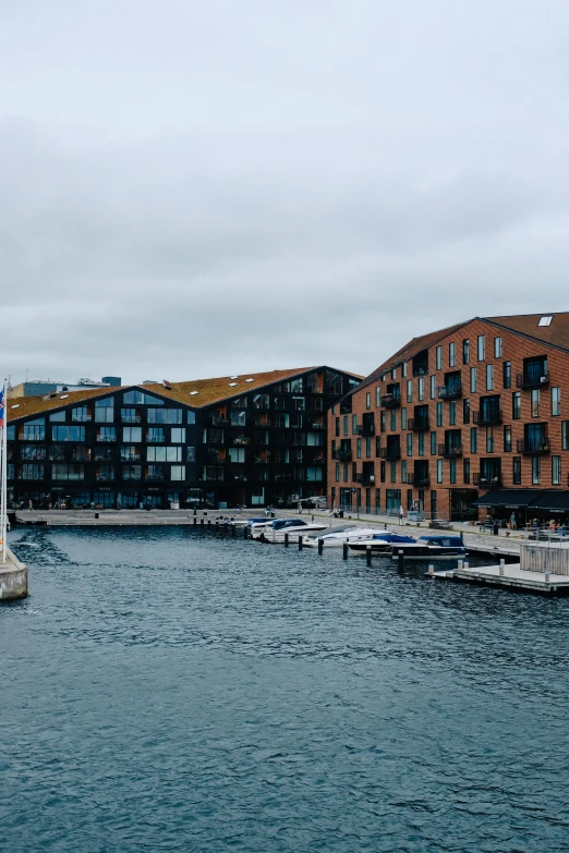 a bunch of buildings sitting along a river