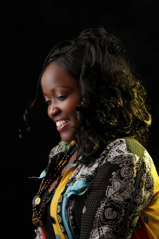 a woman in an ethnic blouse looking at her cellphone