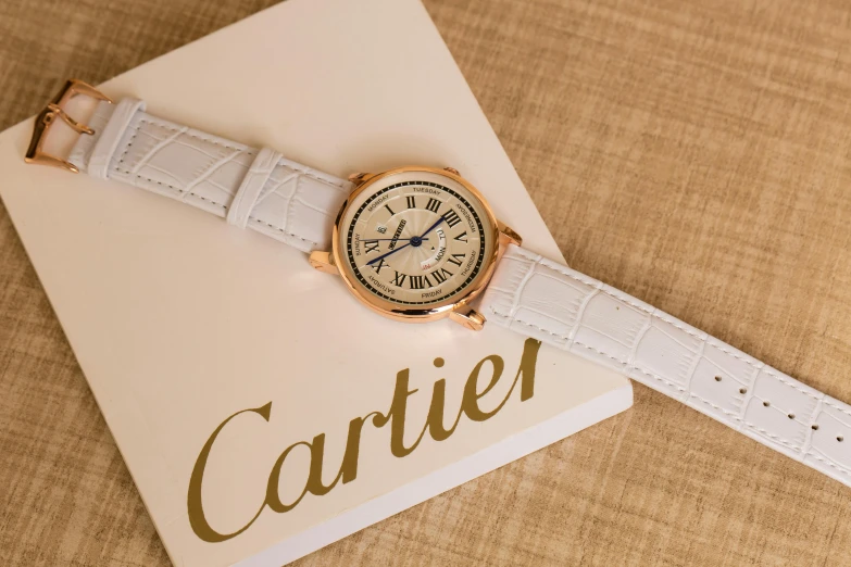 a watch sitting on top of a card