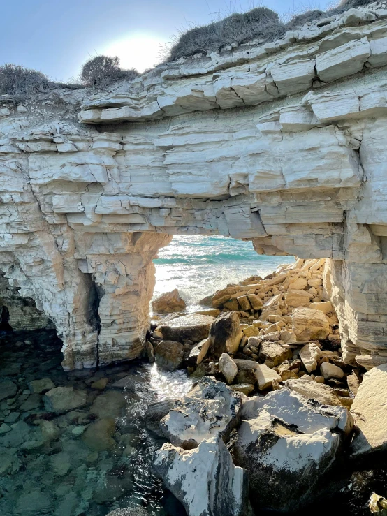 a large rock formation near the ocean