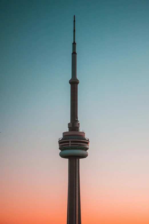 a large tower with the sky in the background