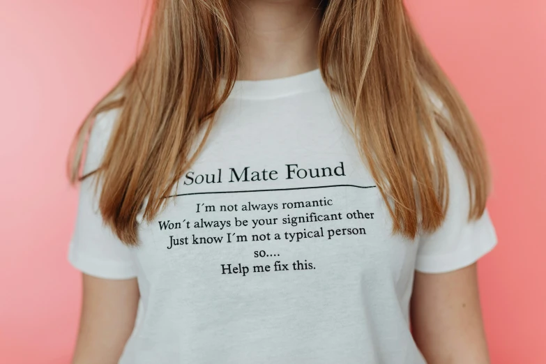 young woman with closed eyes wearing a t - shirt that reads soul mate found