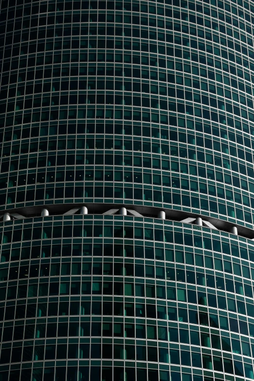 there is a very large round piece of glass covering the building