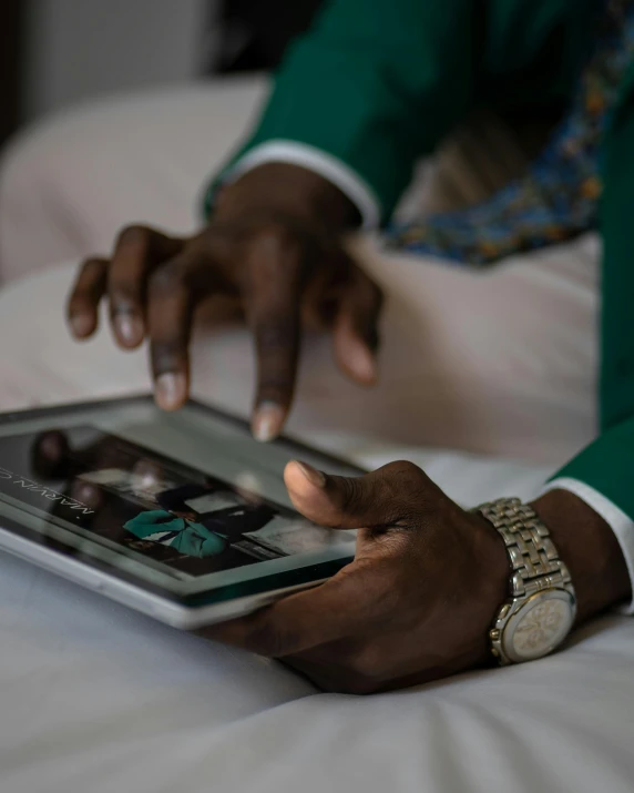 a hand is holding an electronic device and it shows the time on the screen