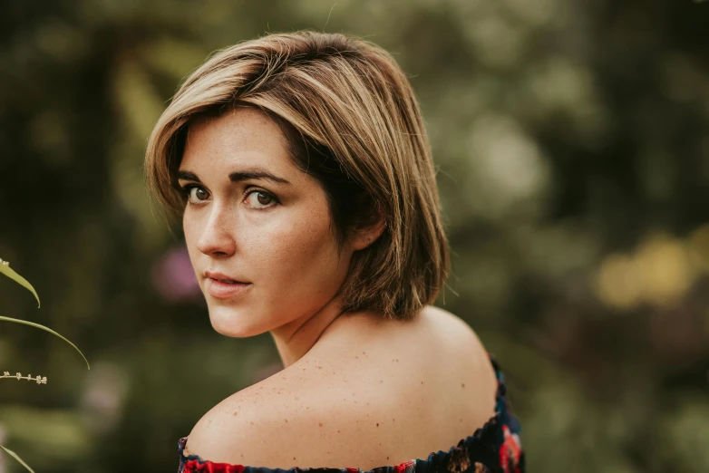 a close up of a woman posing for a po