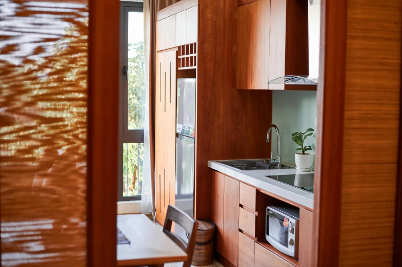 view into an outdoor kitchen and dining area