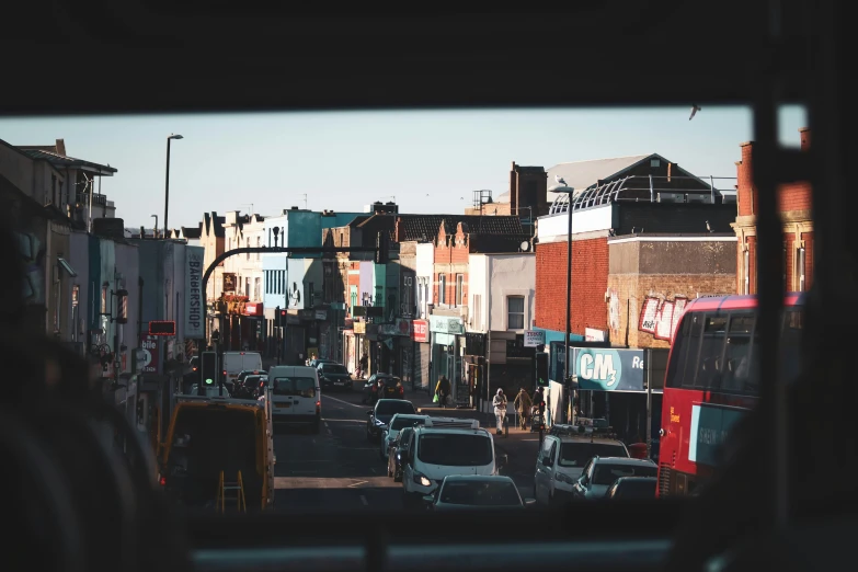 a bunch of cars drive down a street