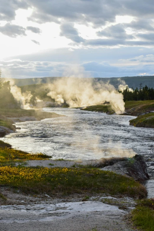 a very small river with steam rising from it