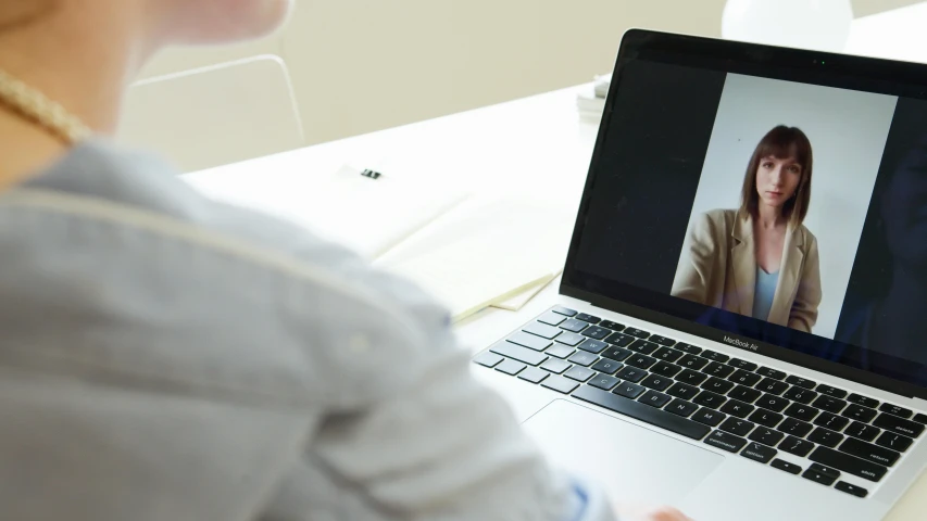 the girl is getting ready to do a video conference