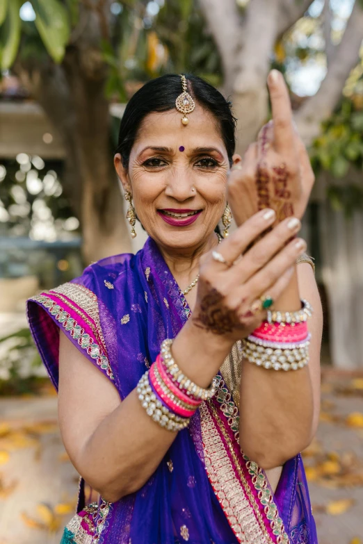 an older woman giving the peace sign