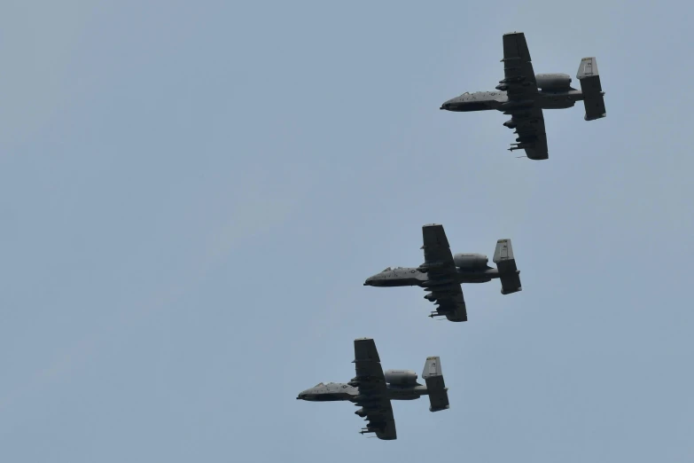 four jets fly in unison in the sky