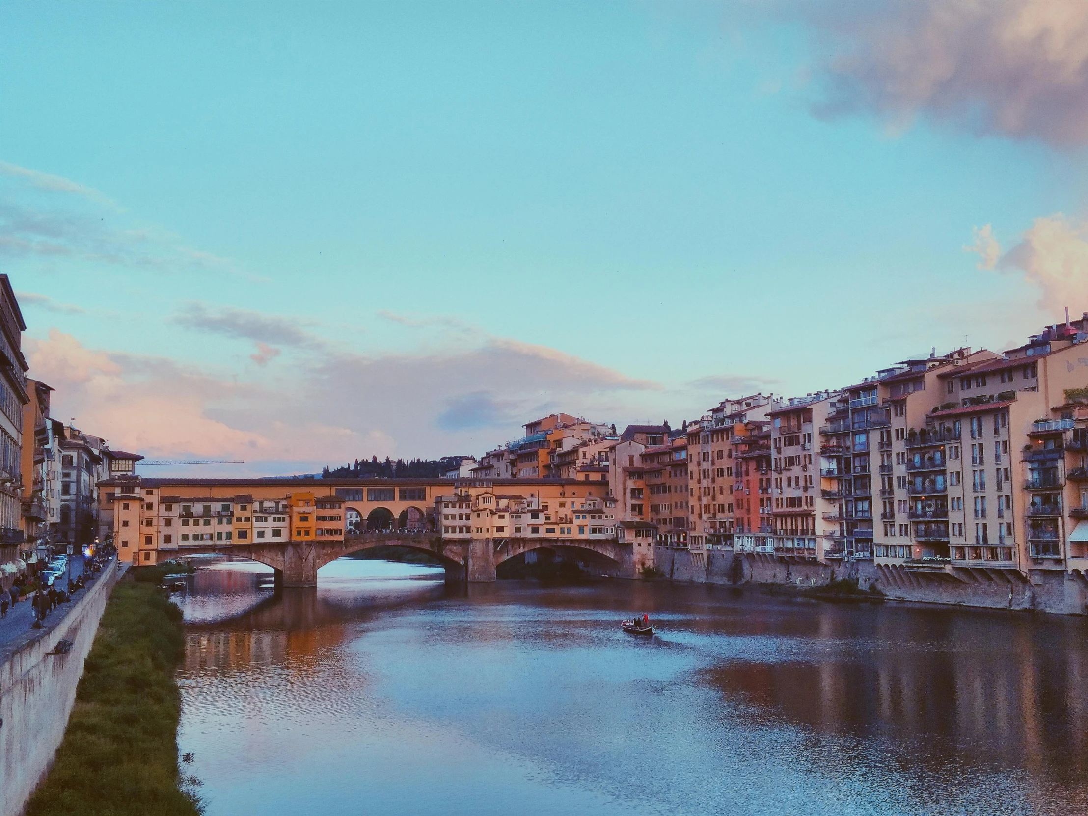 the river running through town and a bridge in the background