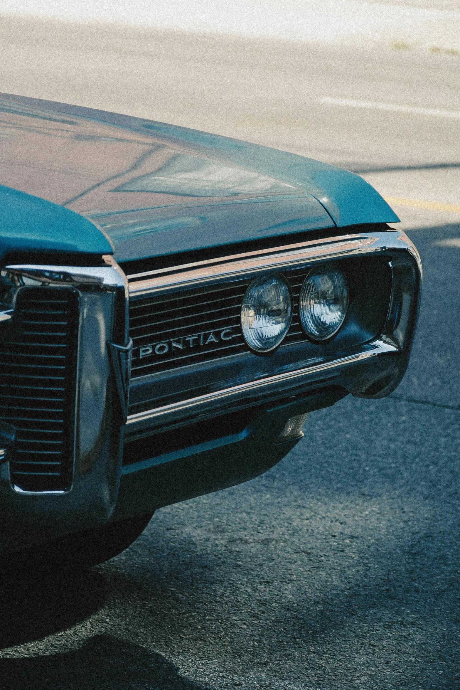 closeup of a vintage muscle car in the street