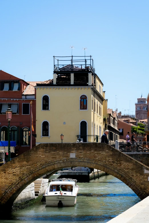 a waterway with boats parked along the sides