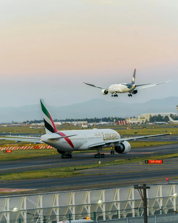 a plane taking off and another one landing