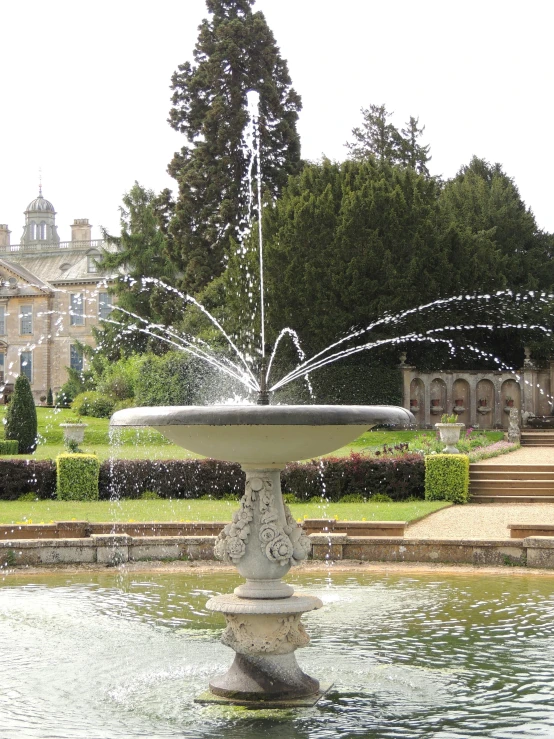 a fountain that is inside a small park