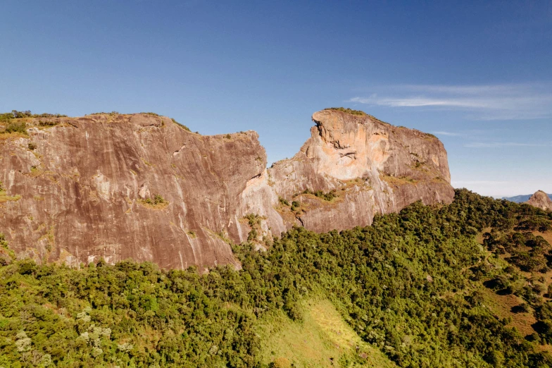 an aerial s of an area with a large rock formation and trees