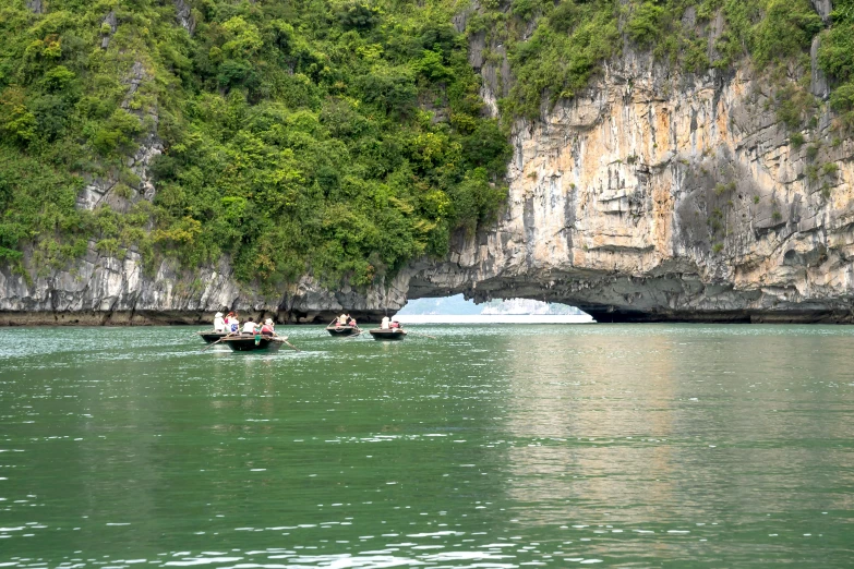 the boats have people riding in it on the water