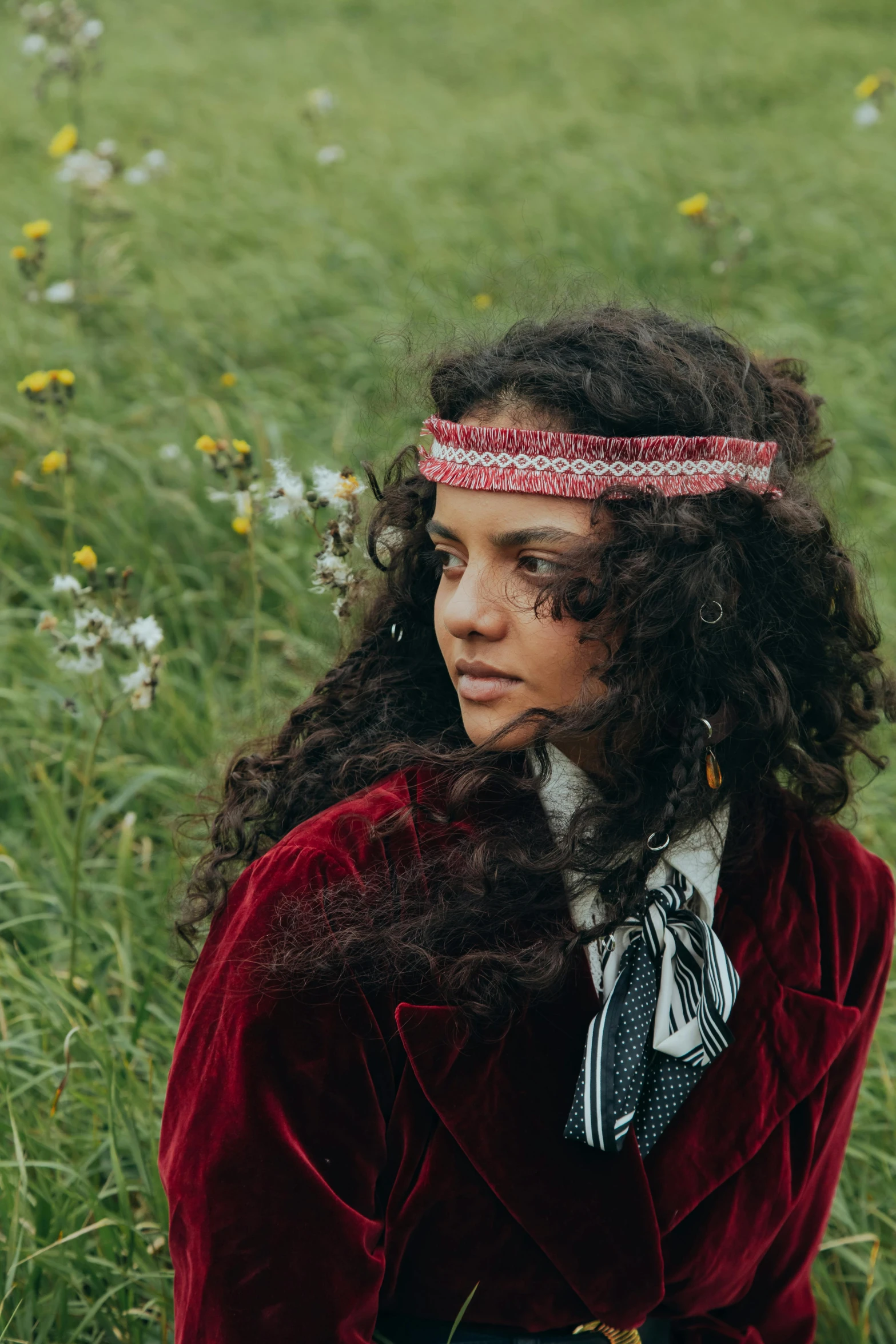 a young woman with long hair in a field